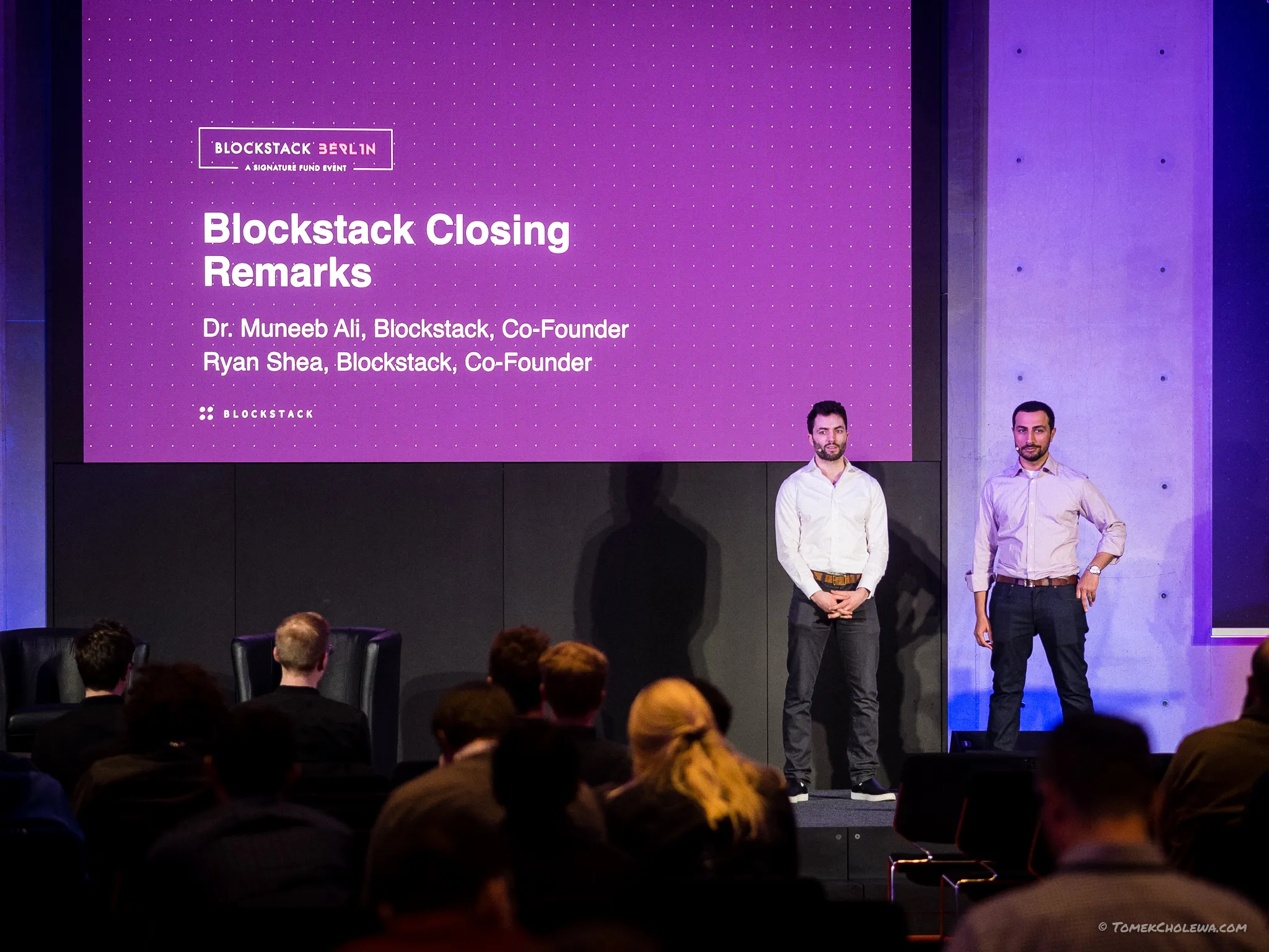 Two Blockstack co-founders deliver closing remarks on the purple-lit stage.